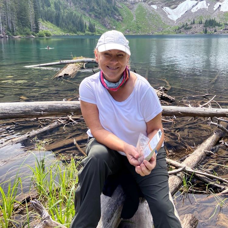 A photo of Barb by a mountain lake